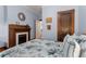 Cozy bedroom featuring a fireplace and warm, neutral-colored walls at 239 Kings Hwy, Decatur, GA 30030