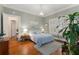 Bright bedroom with hardwood floors and a large window with shutter, filled with natural light at 239 Kings Hwy, Decatur, GA 30030
