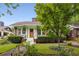 Inviting brick home featuring a quaint front yard, lush landscaping, and a welcoming front entrance at 239 Kings Hwy, Decatur, GA 30030