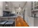 Long galley kitchen featuring custom cabinetry, stainless steel appliances, and beautiful marble countertops at 239 Kings Hwy, Decatur, GA 30030