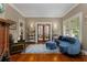 Bright living room showcasing hardwood floors, a decorative fireplace, and stylish blue furniture at 239 Kings Hwy, Decatur, GA 30030