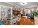 Spacious living area featuring hardwood floors, a fireplace, and dining space with lots of natural light at 239 Kings Hwy, Decatur, GA 30030