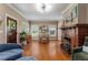 Spacious living area with hardwood floors, a decorative fireplace, and lots of natural light at 239 Kings Hwy, Decatur, GA 30030