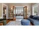 Bright living room featuring French doors, hardwood floors, bookshelves, and stylish decor at 239 Kings Hwy, Decatur, GA 30030