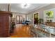 Bright and airy living room flows into the dining area, with views of a sunroom and fireplace at 239 Kings Hwy, Decatur, GA 30030