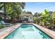 Backyard pool with brick border, lounge chairs, and manicured backyard at 239 Kings Hwy, Decatur, GA 30030