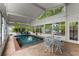 Indoor pool with abundant natural light and an adjacent outdoor dining area at 239 Kings Hwy, Decatur, GA 30030