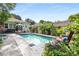 Backyard pool with lounge chairs, dining area, and lush greenery at 239 Kings Hwy, Decatur, GA 30030