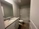 Clean bathroom with granite countertops, single sink and shower and tub combo at 25 Yellow Brick Way, Covington, GA 30014