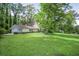 Beautiful home with a well-maintained lawn and mature trees, offering a serene and inviting curb appeal at 2820 Georgian Ter, Marietta, GA 30068