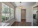 Eat-in kitchen area featuring light fixture, large windows and hardwood floors at 2820 Georgian Ter, Marietta, GA 30068