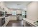 Well-lit kitchen featuring modern cabinetry, countertops, backsplash, and stainless steel appliances at 2820 Georgian Ter, Marietta, GA 30068