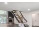 Bright living room with a brick fireplace, wood-look floors, and staircase at 2820 Georgian Ter, Marietta, GA 30068