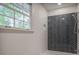 Tiled shower with a modern design featuring dark gray subway tiles in a herringbone pattern at 2820 Georgian Ter, Marietta, GA 30068