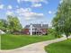 Spacious backyard featuring a well-maintained lawn, patio, and deck, perfect for outdoor entertaining at 5945 Bannister Rd, Cumming, GA 30028