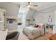 This carpeted bedroom features a ceiling fan, a bed and decorative accents at 5945 Bannister Rd, Cumming, GA 30028