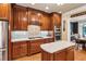 Gourmet kitchen features a gas cooktop, stainless steel appliances, and granite countertops at 5945 Bannister Rd, Cumming, GA 30028