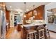 Kitchen features custom cabinetry, stainless steel appliances, and a breakfast bar with seating at 5945 Bannister Rd, Cumming, GA 30028