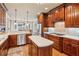 Spacious kitchen with stainless steel appliances, central island, and a view to the dining area at 5945 Bannister Rd, Cumming, GA 30028