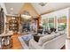 Living room showcases a stone fireplace, hardwood floors, and built-in shelving at 5945 Bannister Rd, Cumming, GA 30028