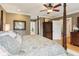 Comfortable main bedroom featuring a four-poster bed and ensuite bathroom at 5945 Bannister Rd, Cumming, GA 30028