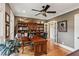 Cozy office space with hardwood floors, built-in bookshelves, and a comfortable seating area at 5945 Bannister Rd, Cumming, GA 30028
