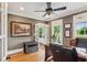 Well-lit office with hardwood floors, neutral walls, and a picturesque view from the windows at 5945 Bannister Rd, Cumming, GA 30028