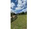 Picturesque property with fenced pastures surrounding a beautiful home, providing serene country living at 5945 Bannister Rd, Cumming, GA 30028
