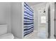 This bathroom features tile floors, shower with curtain, and access to the bedroom at 1560 Sarah M Harden Dr, Atlanta, GA 30311
