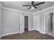 This bedroom features wood floors, light gray walls, and double-door closet at 1560 Sarah M Harden Dr, Atlanta, GA 30311
