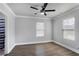 This bedroom features wood floors, light gray walls, and a ceiling fan at 1560 Sarah M Harden Dr, Atlanta, GA 30311