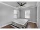 Bedroom with bare mattress, ceiling fan, crown molding and windows bringing in natural light at 1560 Sarah M Harden Dr, Atlanta, GA 30311