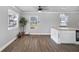 Bright dining area with hardwood floors and modern pendant lighting above the island at 1560 Sarah M Harden Dr, Atlanta, GA 30311