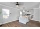 Bright dining area featuring a kitchen island, hardwood floors, and natural light at 1560 Sarah M Harden Dr, Atlanta, GA 30311