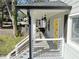 Inviting front porch featuring a cozy porch swing and modern railings at 1560 Sarah M Harden Dr, Atlanta, GA 30311