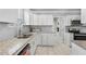 Well-lit kitchen featuring stainless steel appliances, granite countertops and white cabinets at 1560 Sarah M Harden Dr, Atlanta, GA 30311