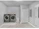 This laundry room features updated appliances and tile floors at 1560 Sarah M Harden Dr, Atlanta, GA 30311