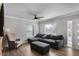 Bright living room featuring a comfortable gray sectional sofa and hardwood floors at 1560 Sarah M Harden Dr, Atlanta, GA 30311