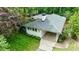 Beautiful white painted brick home with grey roof, covered parking and professional landscaping at 2298 Pembrook Pl, Atlanta, GA 30324