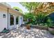 Backyard patio with brick pavers, landscaping, and a rain chain at 2298 Pembrook Pl, Atlanta, GA 30324