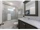 Bathroom includes a tub/shower, single vanity with marble countertops, and great lighting at 2298 Pembrook Pl, Atlanta, GA 30324