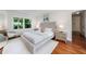Bright bedroom with hardwood floors and natural light from the window highlighting the neutral tones at 2298 Pembrook Pl, Atlanta, GA 30324