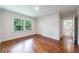 Bedroom boasts hardwood floors, natural light, and access to an ensuite bath at 2298 Pembrook Pl, Atlanta, GA 30324