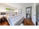 A calm bedroom featuring hardwood floors, natural lighting, and views to other parts of the house at 2298 Pembrook Pl, Atlanta, GA 30324