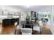 Open concept dining area with modern lighting and hardwood floors throughout at 2298 Pembrook Pl, Atlanta, GA 30324