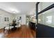 Elegant dining room boasts hardwood floors, modern lighting, and an open view into the kitchen at 2298 Pembrook Pl, Atlanta, GA 30324