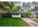 Well-maintained bungalow with a covered carport and tidy landscaping, blending charm and convenience at 2298 Pembrook Pl, Atlanta, GA 30324