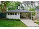 Quaint bungalow with covered parking, featuring fresh landscaping and great curb appeal at 2298 Pembrook Pl, Atlanta, GA 30324