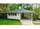 Charming single story home with painted brick, covered porch and beautiful landscaping at 2298 Pembrook Pl, Atlanta, GA 30324