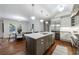 Spacious kitchen connected to dining area, featuring a large island and stainless steel appliances at 2298 Pembrook Pl, Atlanta, GA 30324
